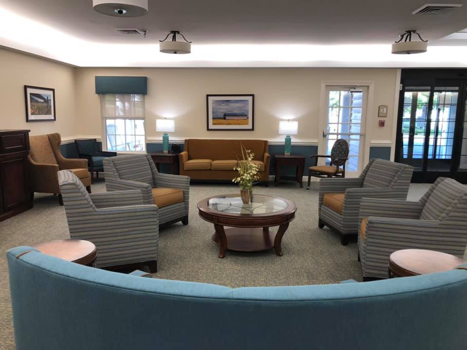 Cozy waiting room with sofas and armchairs