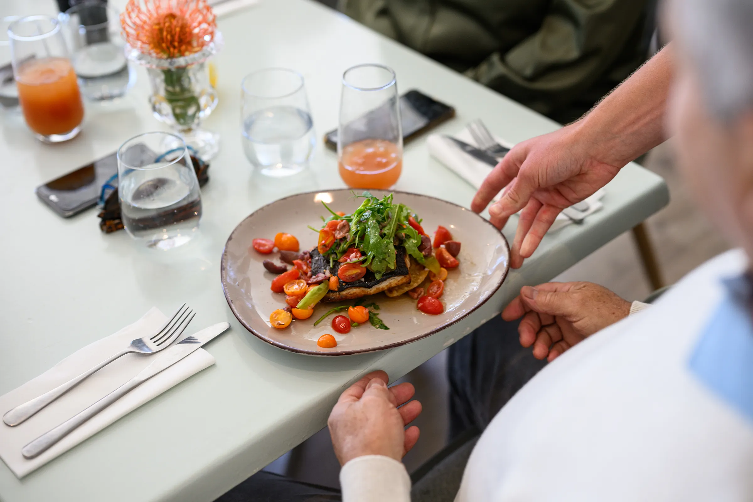 Fresh salad on toast served at restaurant table